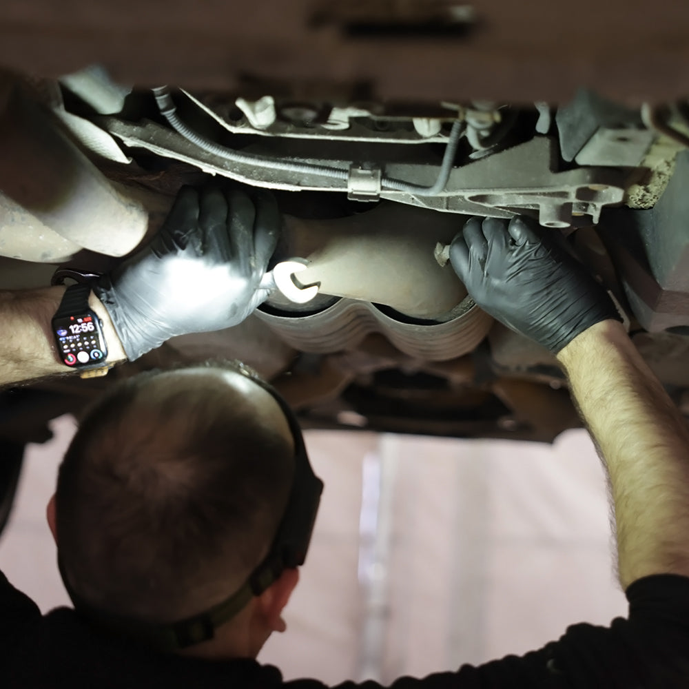 Mechanic working using spanners, wearing Nitrile Gloves